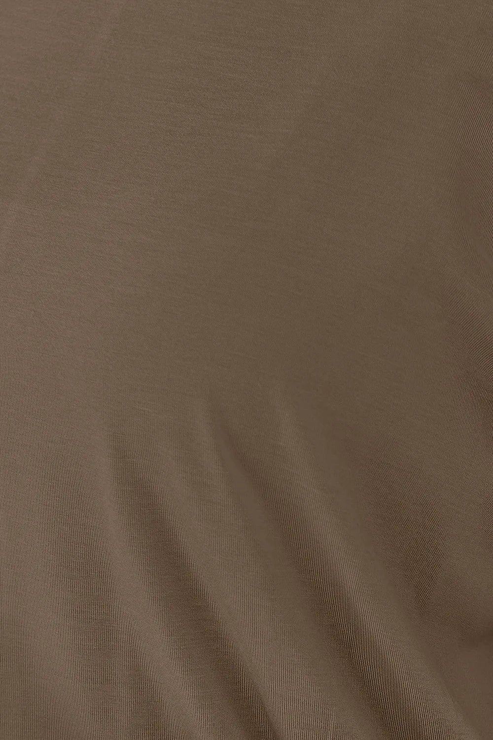 Batwing sleeve top with banded blouson hem