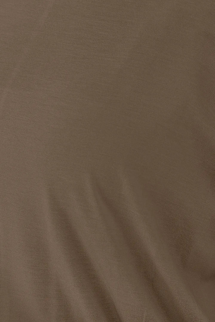 Batwing sleeve top with banded blouson hem