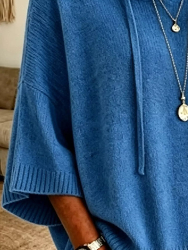 Oversized hooded sweater with drawstring and ribbed trim