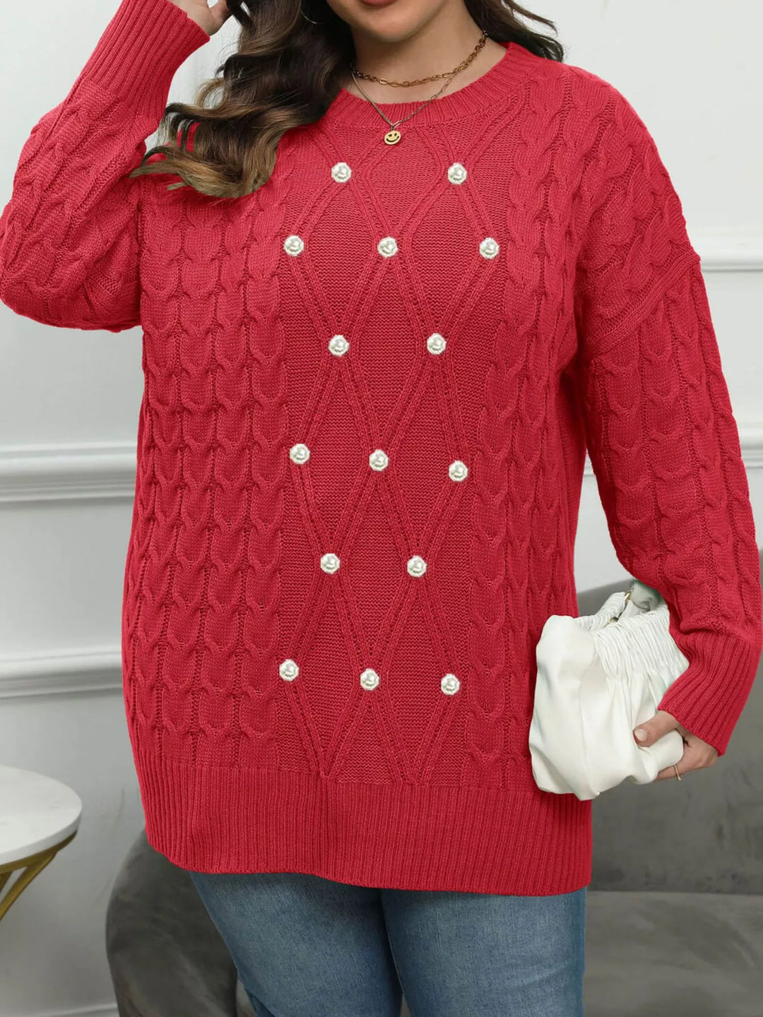 Cable knit dropped shoulder sweater with floral buttons