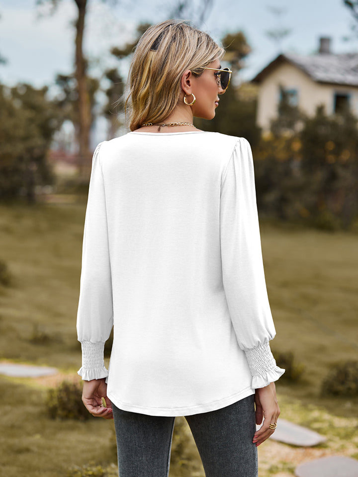 Pintuck pleated puff sleeve blouse with smocked cuffs
