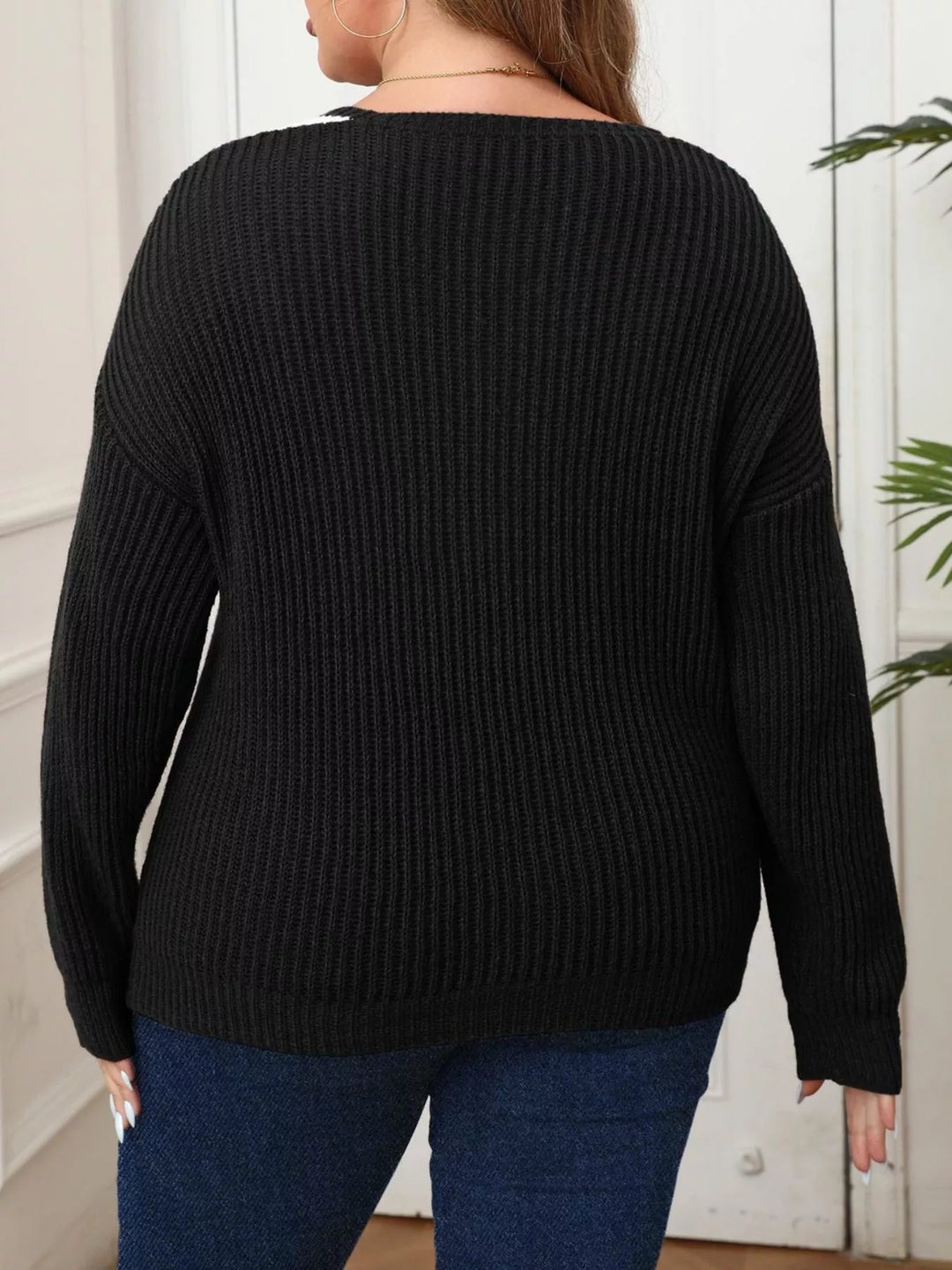 Ribbed knit V-neck sweater with contrast trim and pearl buttons