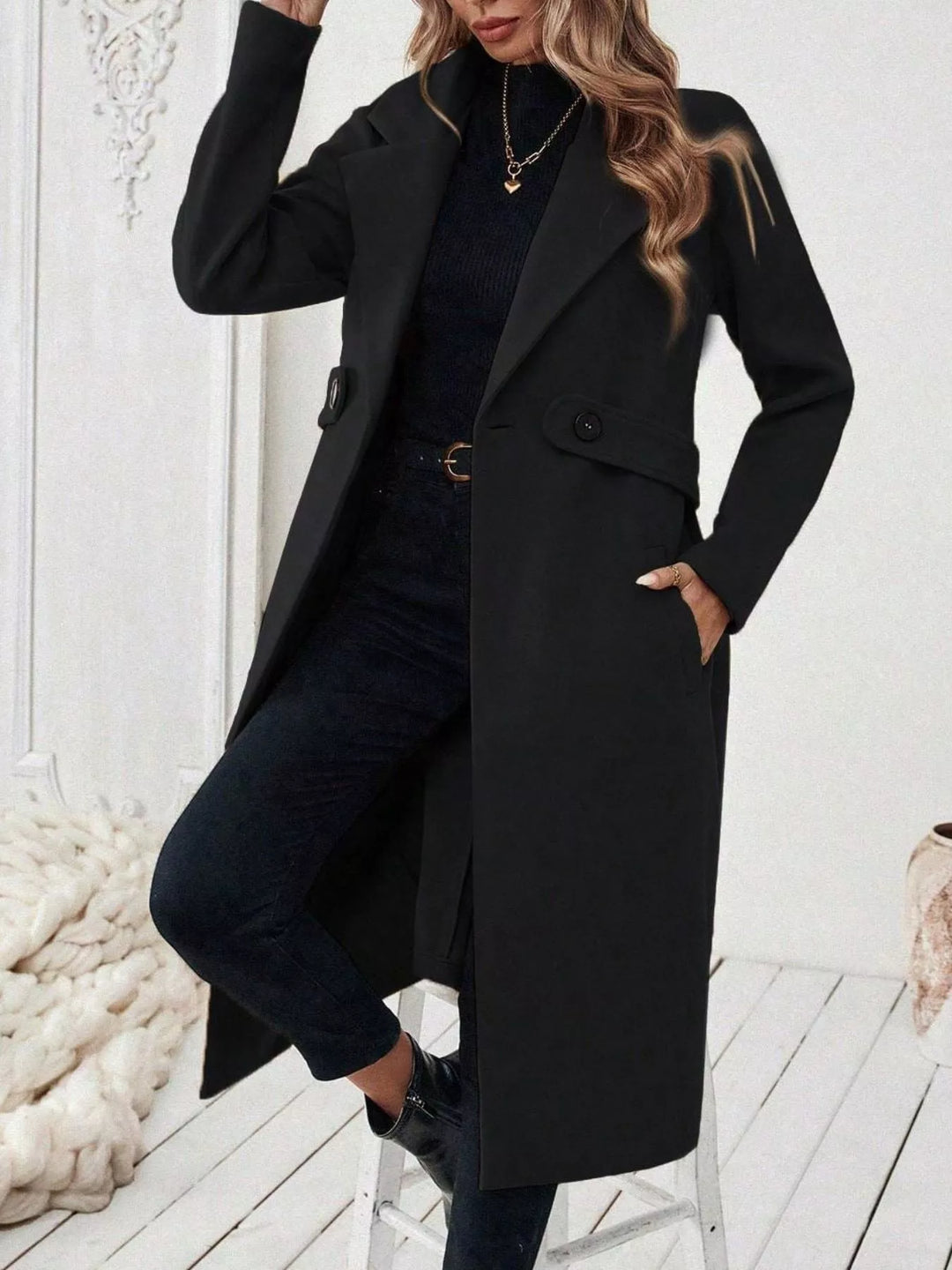 Longline notch lapel coat with single-button waist tab