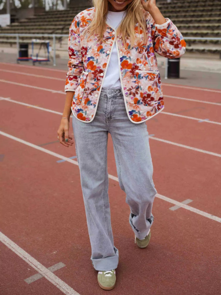 Floral print quilted jacket with contrast piping and patch pockets