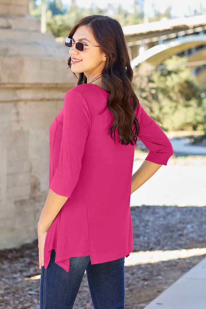 Pocketed 3/4 sleeve top with asymmetrical hem