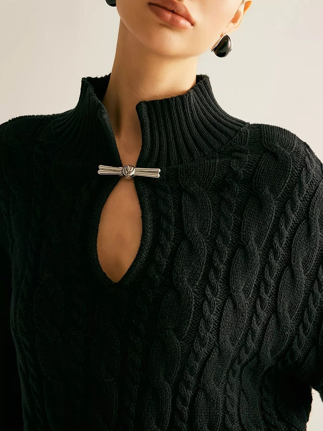 Cable-knit mock neck sweater with keyhole cutout
