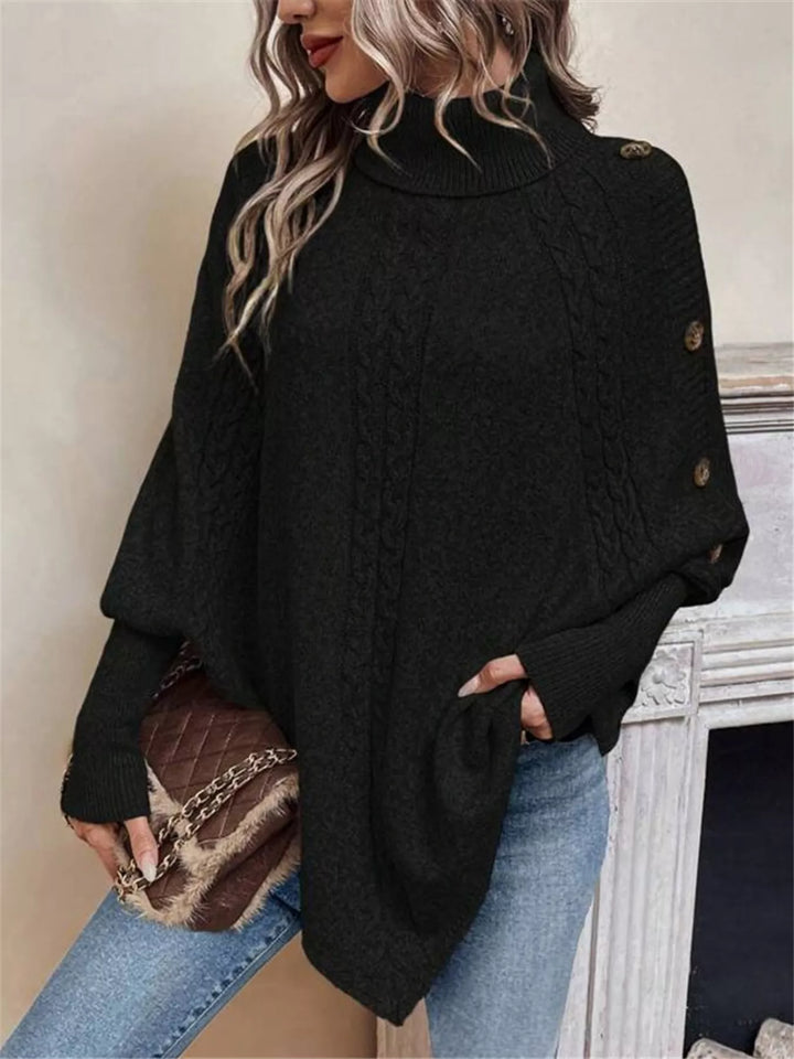 Cable knit turtleneck cape sweater with button shoulder