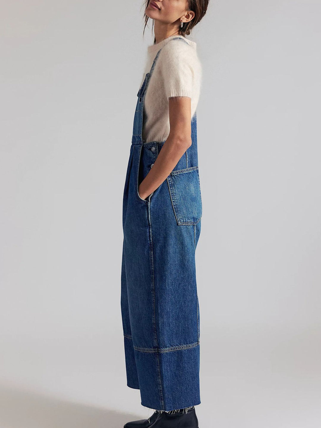 Pleated wide-leg denim overalls with raw hem