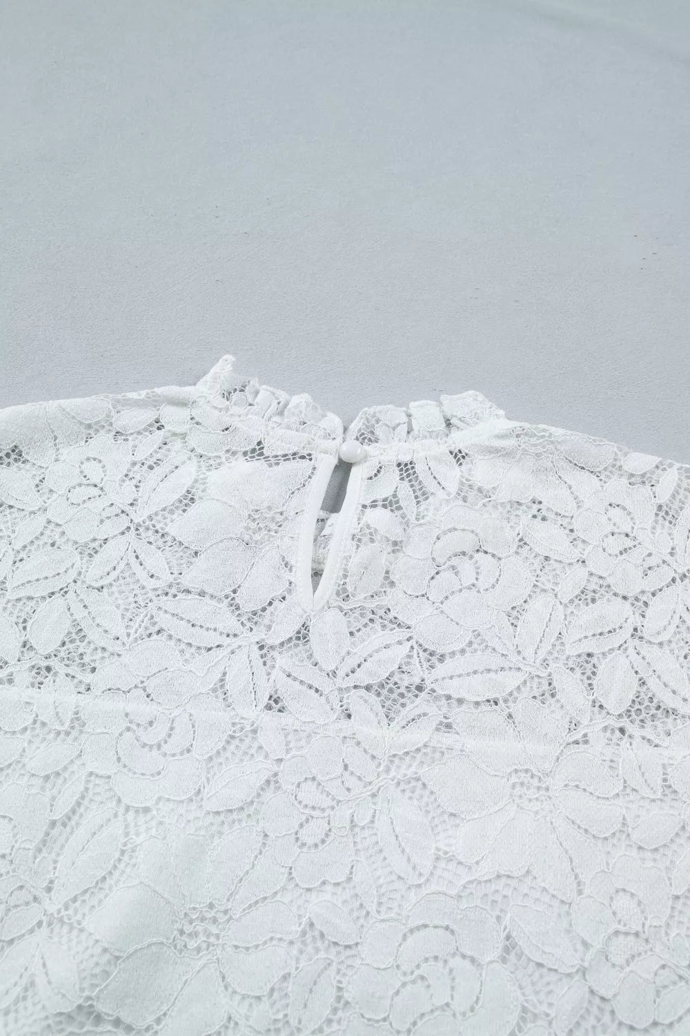 Sheer floral lace blouse with ruffle mock neck and flounce sleeves
