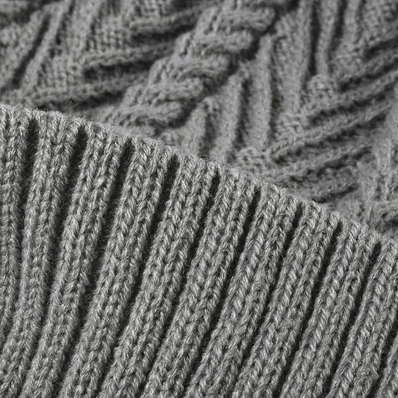 Cable knit beanie with faux fur pompom and ribbed cuff