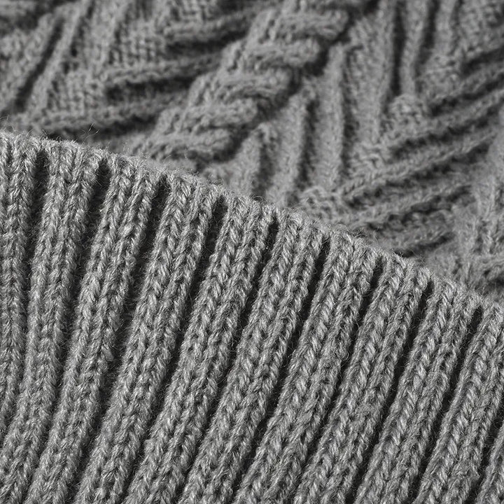 Cable knit beanie with faux fur pompom and ribbed cuff