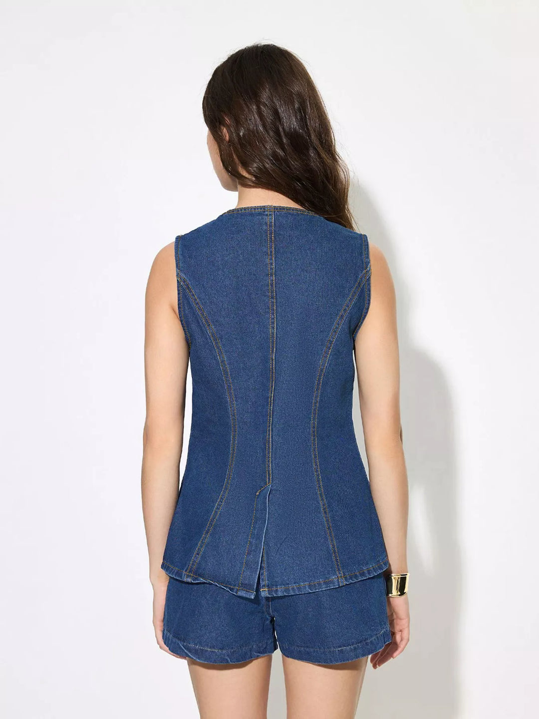 Sleeveless button-up denim top with welt pockets