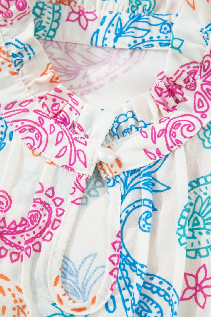 Paisley print keyhole blouse with ruffle neck and puff sleeves