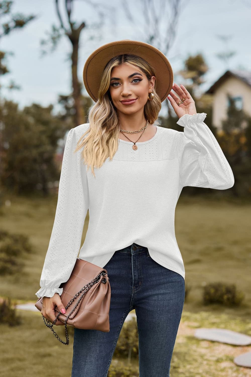 White Eyelet knit puff sleeve blouse with round neckline