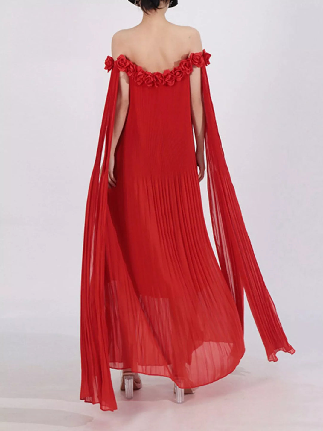 Off-shoulder pleated maxi dress with rosette neckline