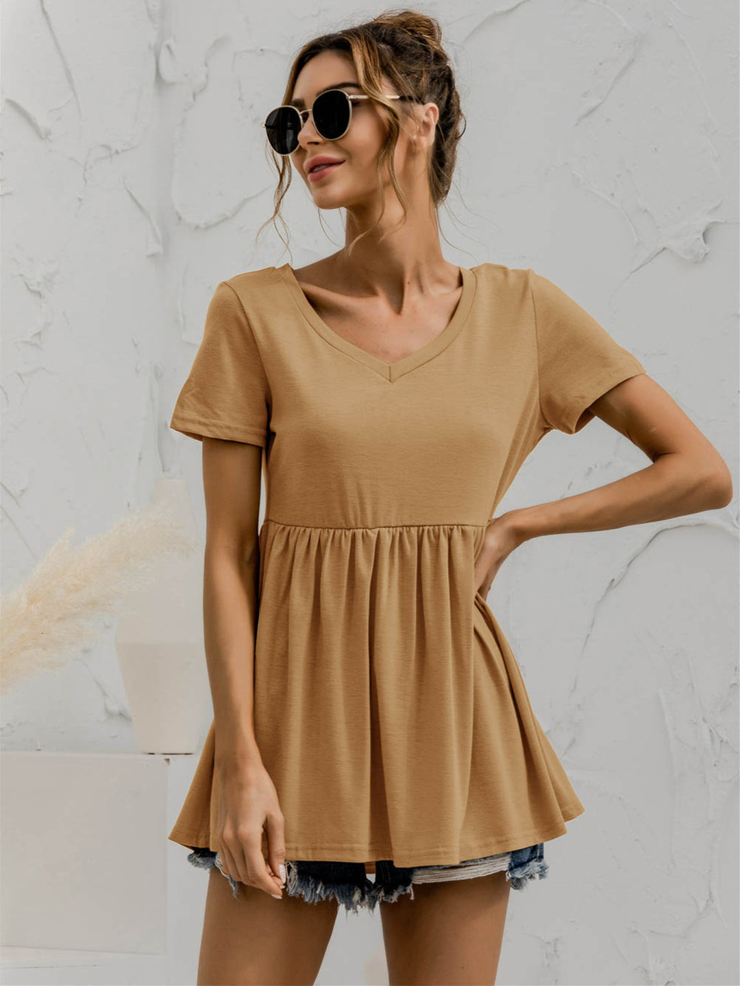 V-neck babydoll top with short sleeves and empire waist