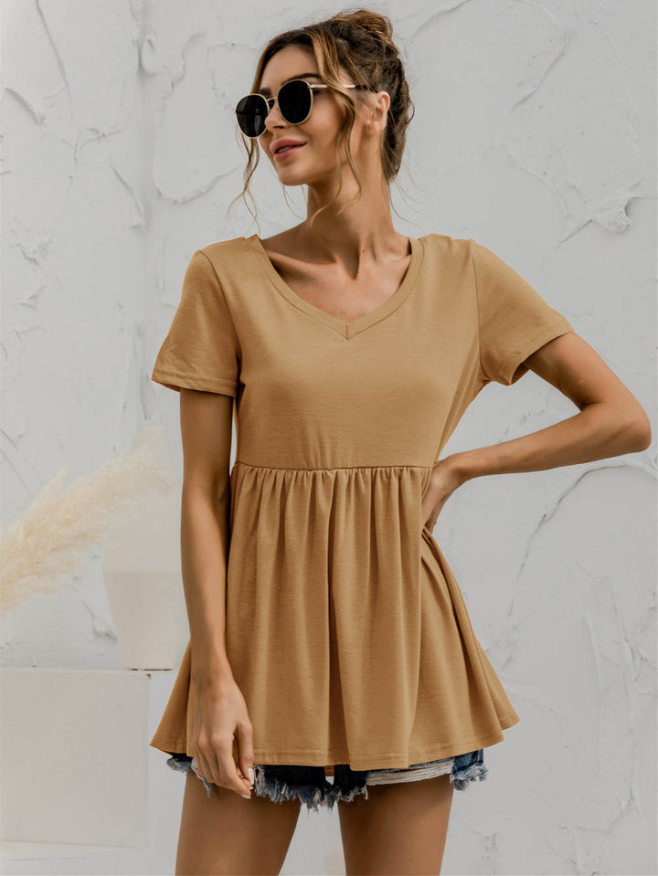 V-neck babydoll top with short sleeves and empire waist