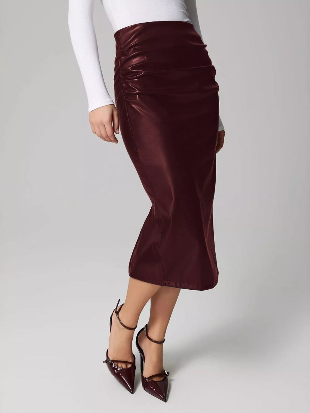 High-rise faux leather midi pencil skirt with back slit