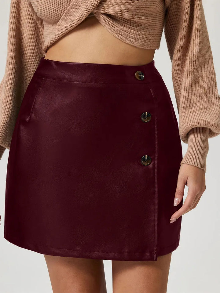 Faux leather high-rise mini skirt with button front detail