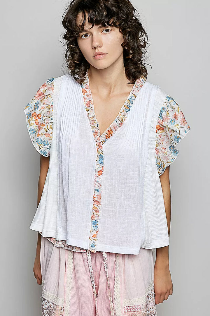 V-neck woven cotton blouse with floral ruffle cap sleeves