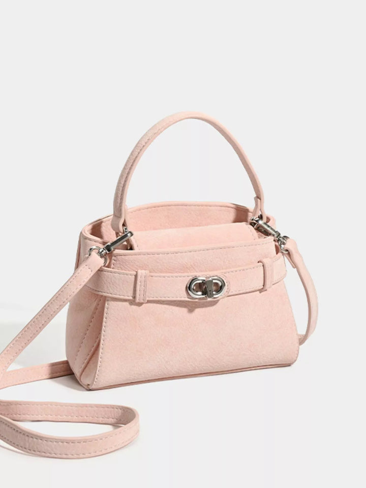 Pink Mini belted crossbody bag with top handle and twist lock