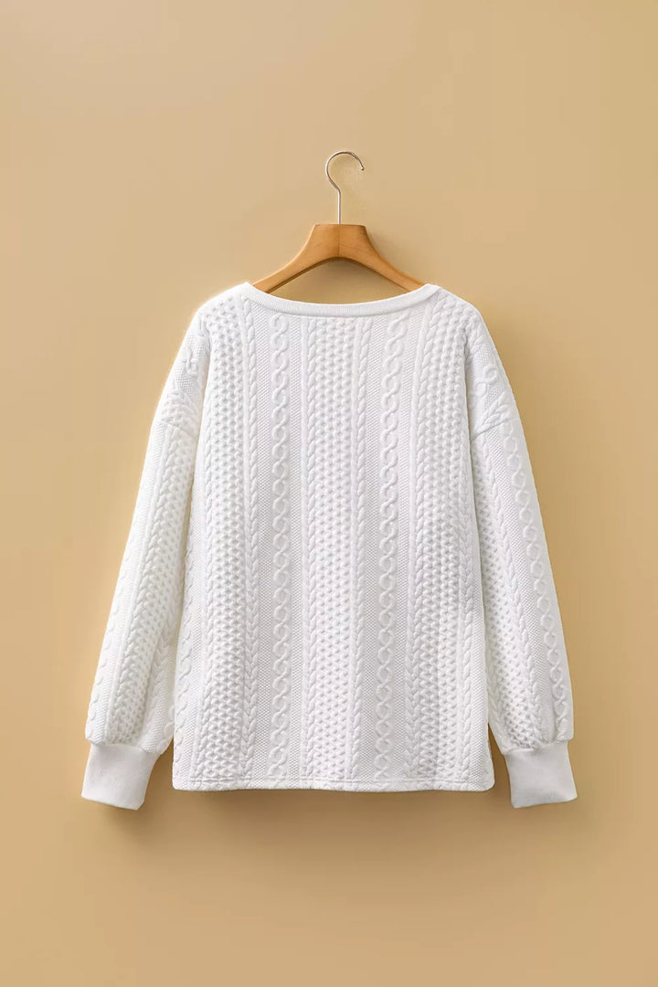 Cable-knit drop-shoulder V-neck pullover sweater