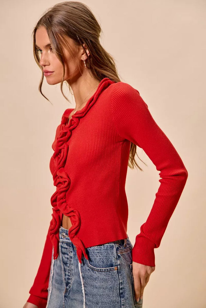 Ribbed knit cardigan with cascade ruffle trim