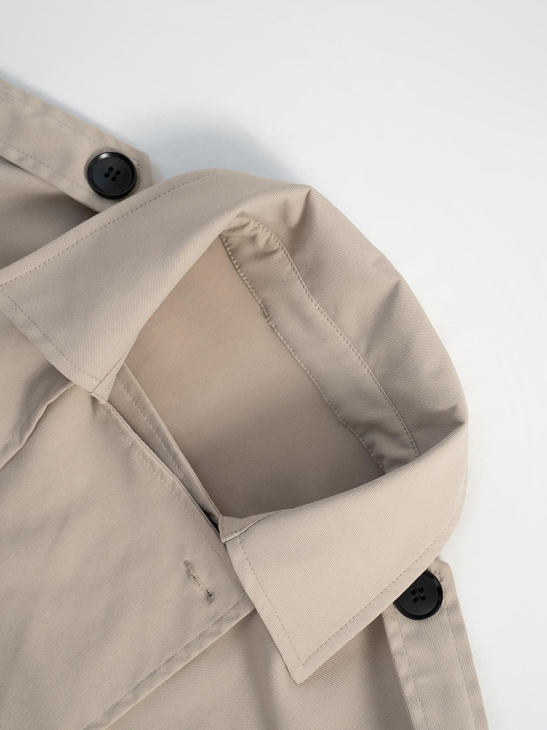 Cropped double-breasted trench jacket with belted cuffs