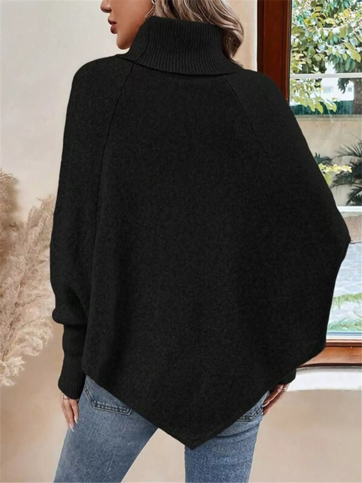 Cable knit turtleneck cape sweater with button shoulder