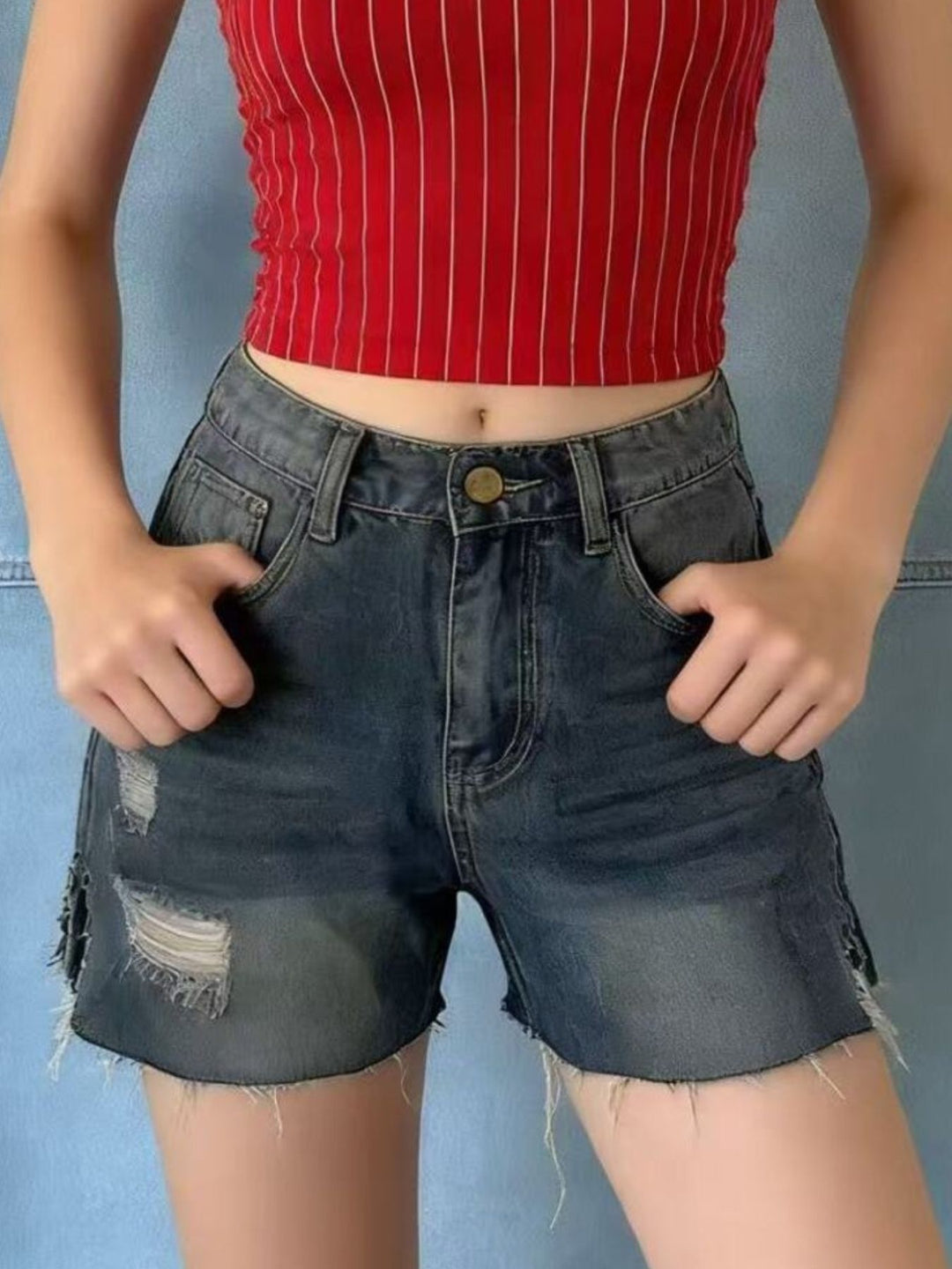 Distressed high-rise denim shorts with frayed raw hem