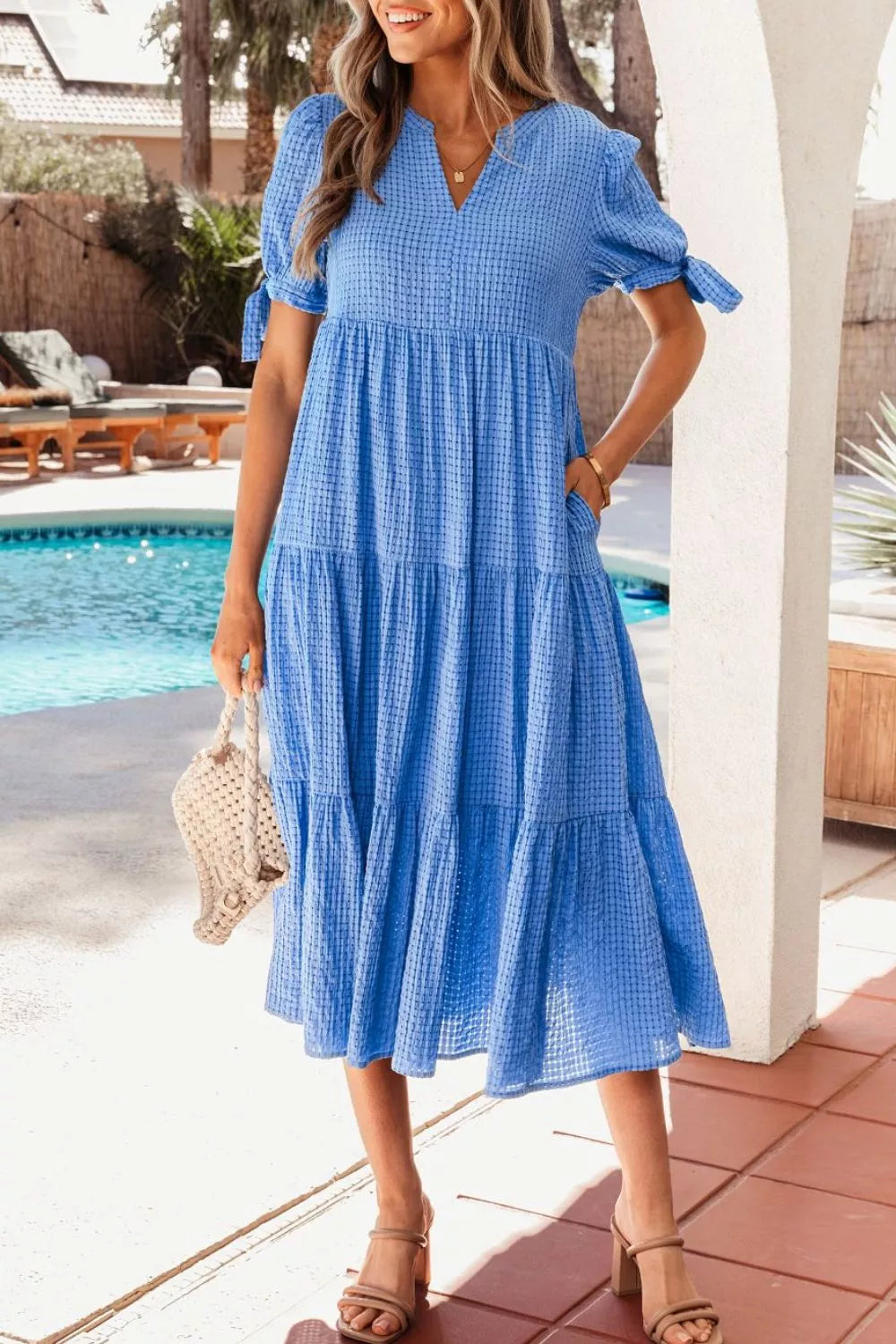 Tiered midi dress with notched neckline and tie sleeves