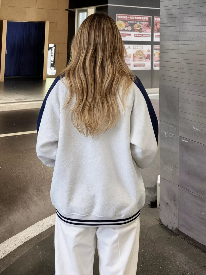 Color block zip-up track jacket with striped ribbed hem