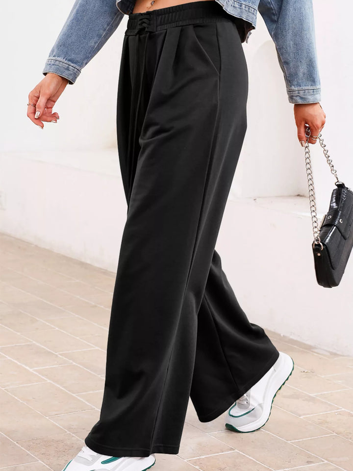 High-rise wide-leg pleated sweatpants with drawstring