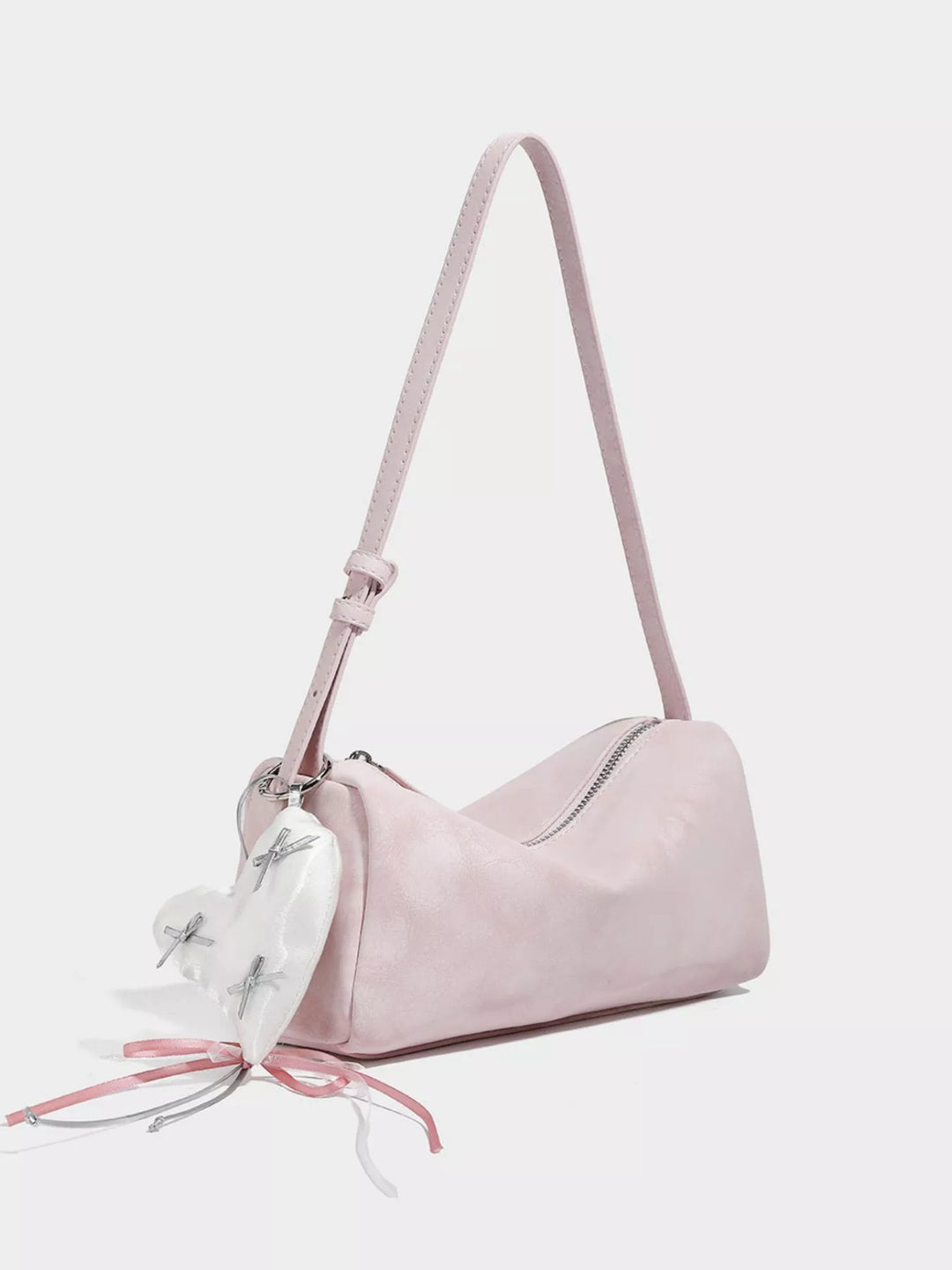 Adjustable strap crossbody bag with heart charm and bow trim