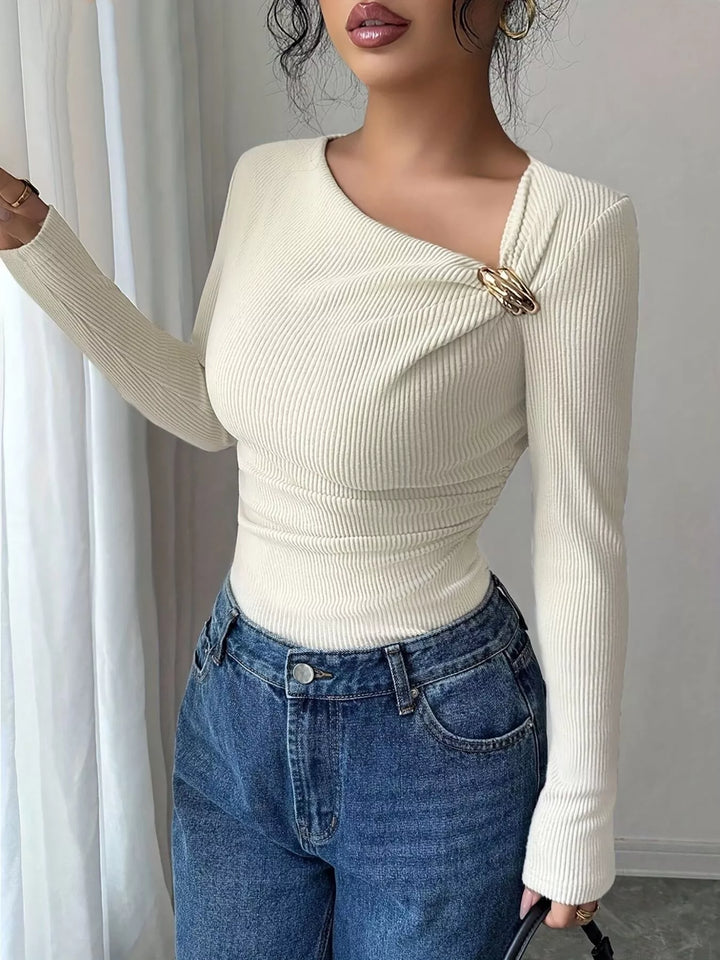 Ivory Ribbed knit asymmetric neckline top with gold buckle twist
