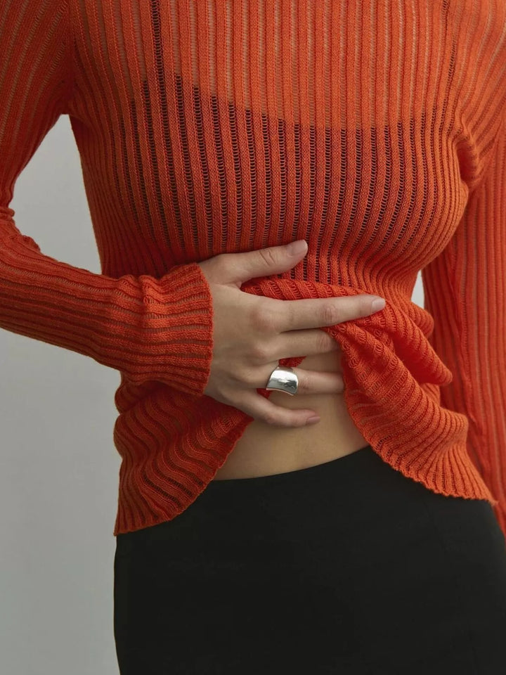 Sheer ribbed knit long sleeve top with flared cuffs