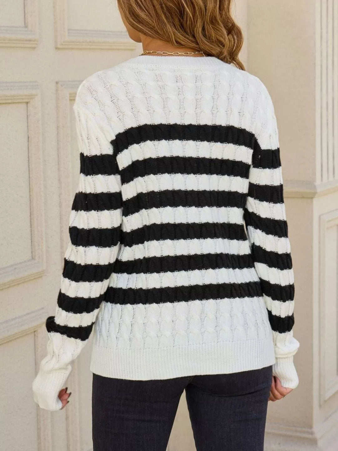 Striped cable knit sweater with ribbed crew neck