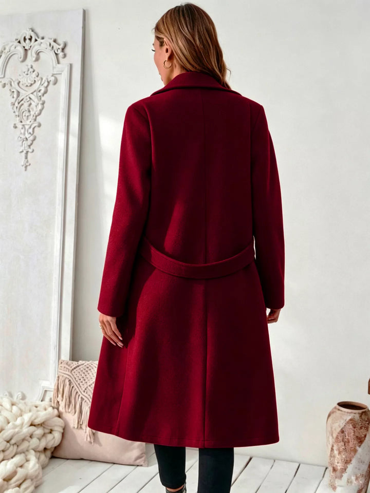 Notched lapel belted longline coat with side pockets
