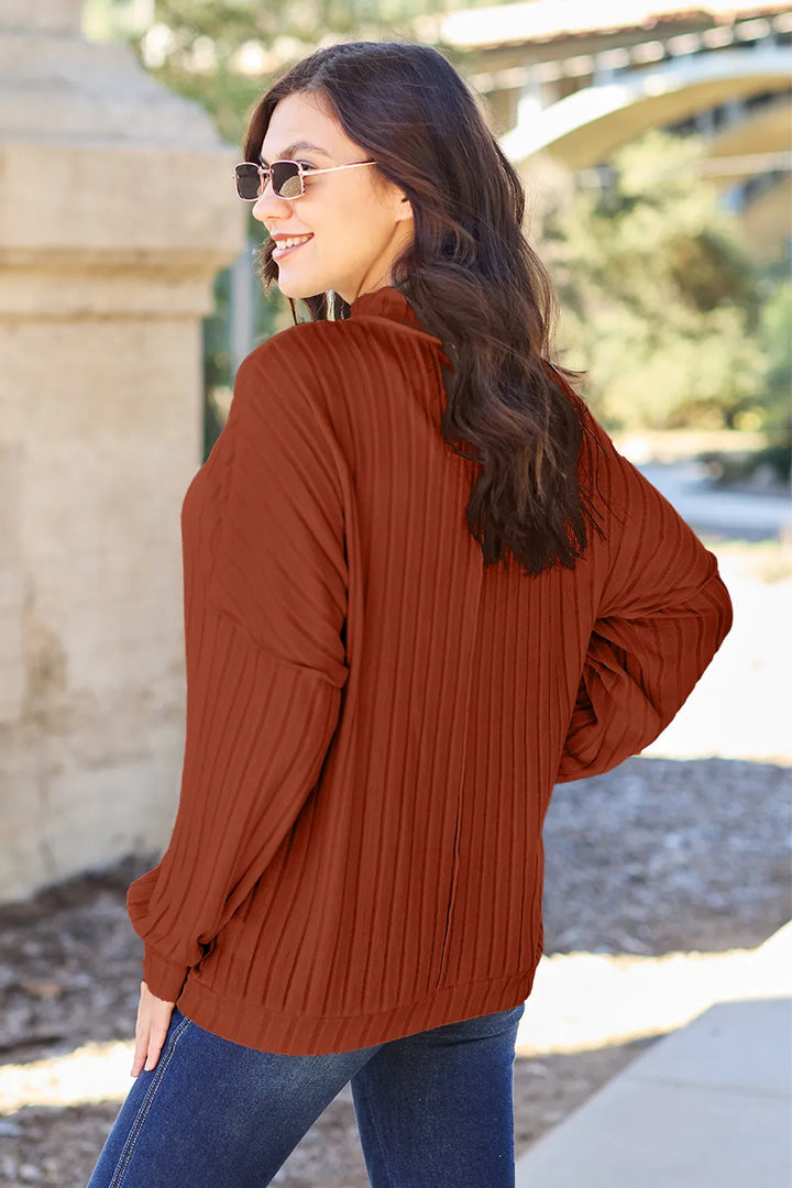 Ribbed exposed-seam mock neck knit top with drop shoulders