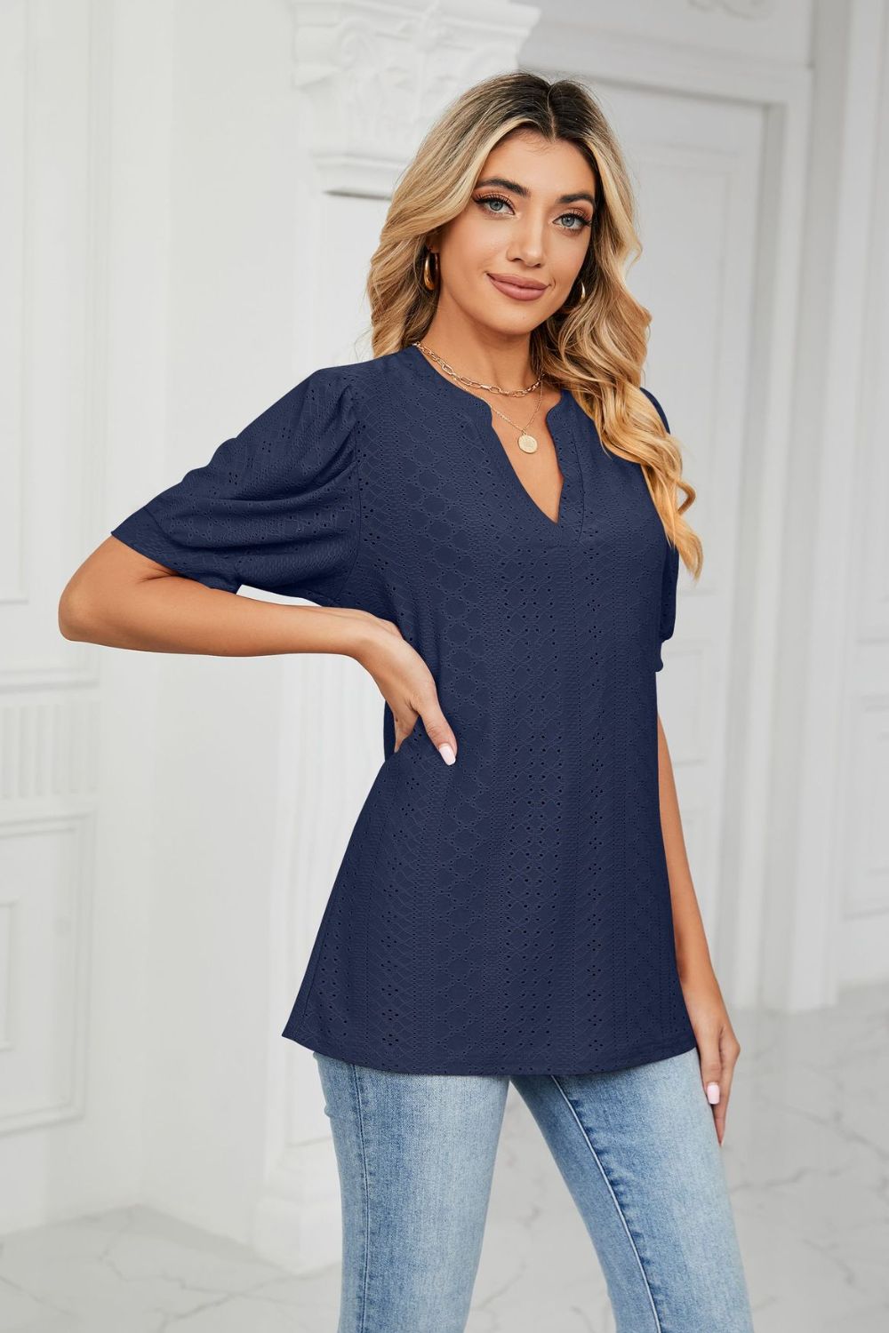 Eyelet puff sleeve top with notched V-neck