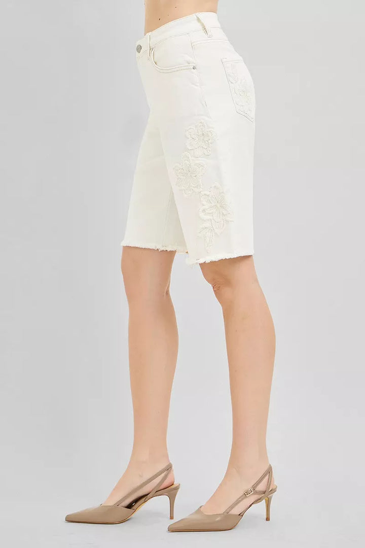 Relaxed Bermuda denim shorts with floral embroidery and raw hem