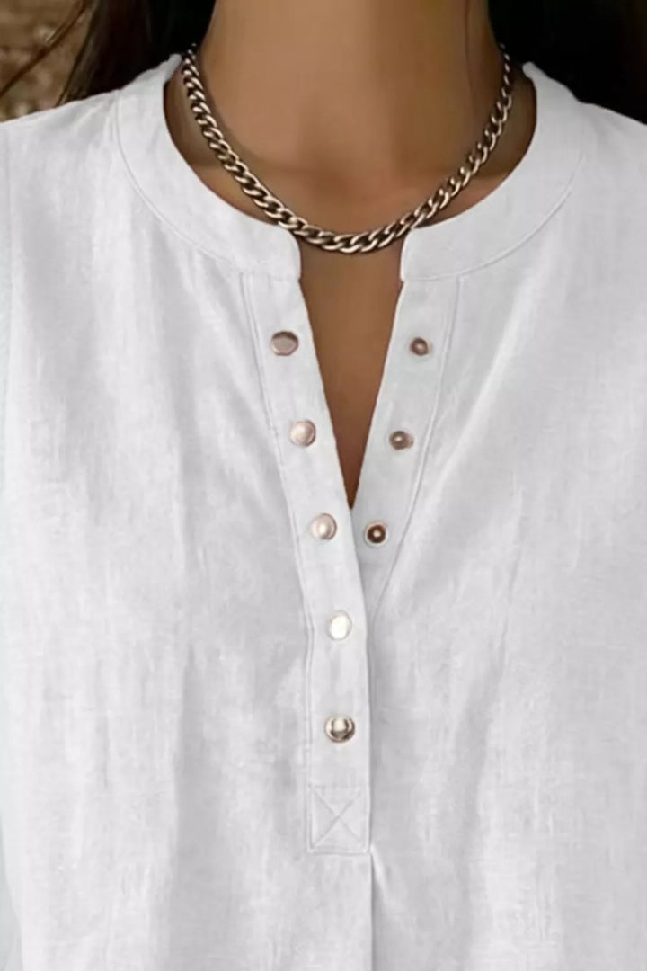 Snap-front sleeveless blouse with V-neckline