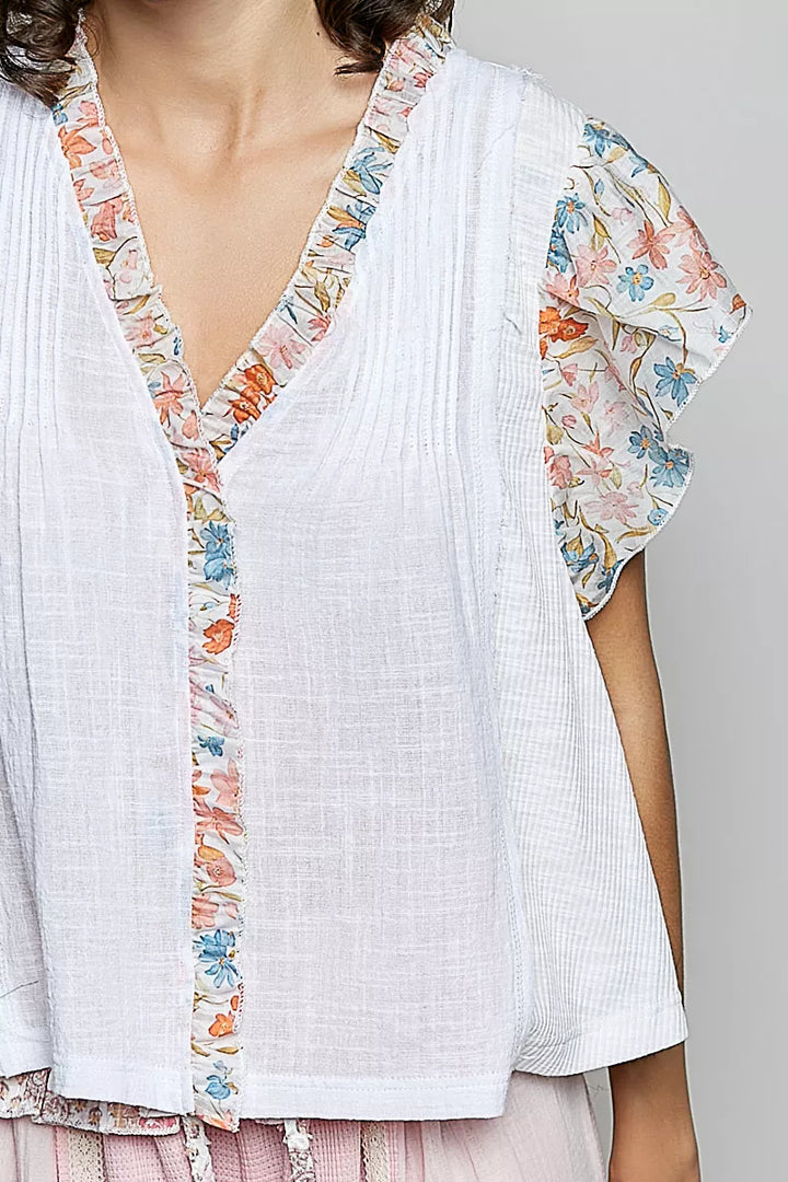 V-neck woven cotton blouse with floral ruffle cap sleeves