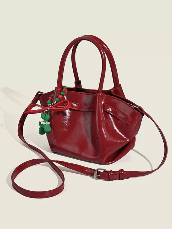 Red Glossy slouchy top handle crossbody bag with beaded charm