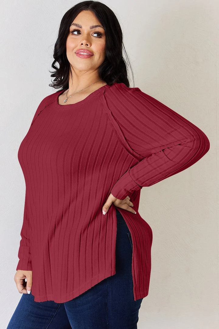 Ribbed knit round neck long sleeve top with side slits