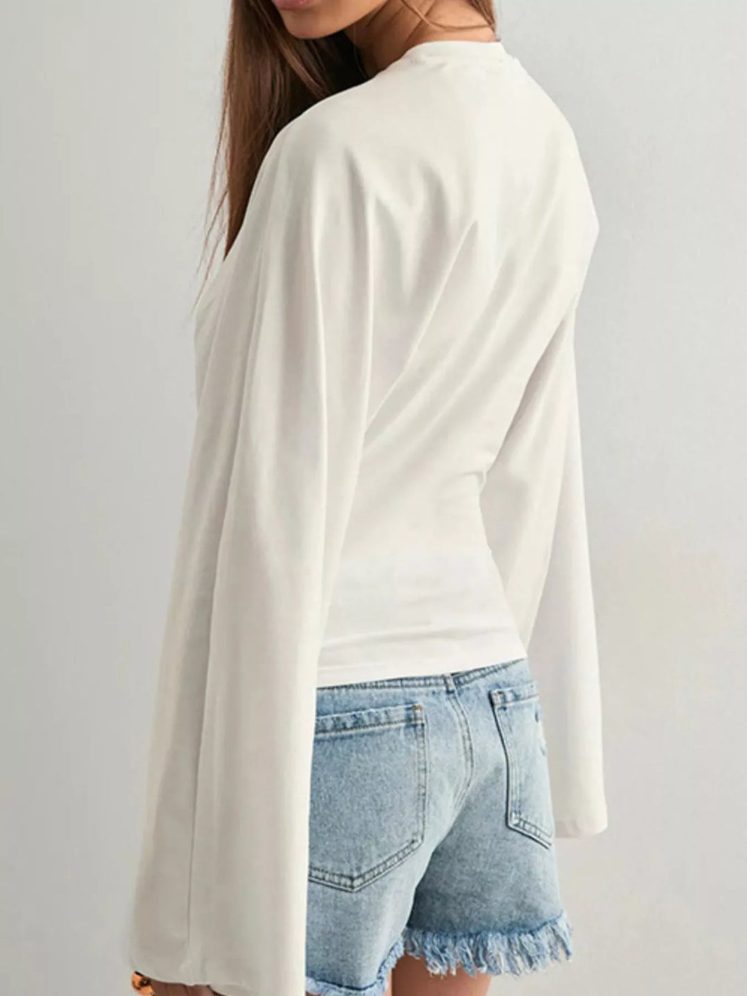 Fitted long sleeve top with flared bell sleeves