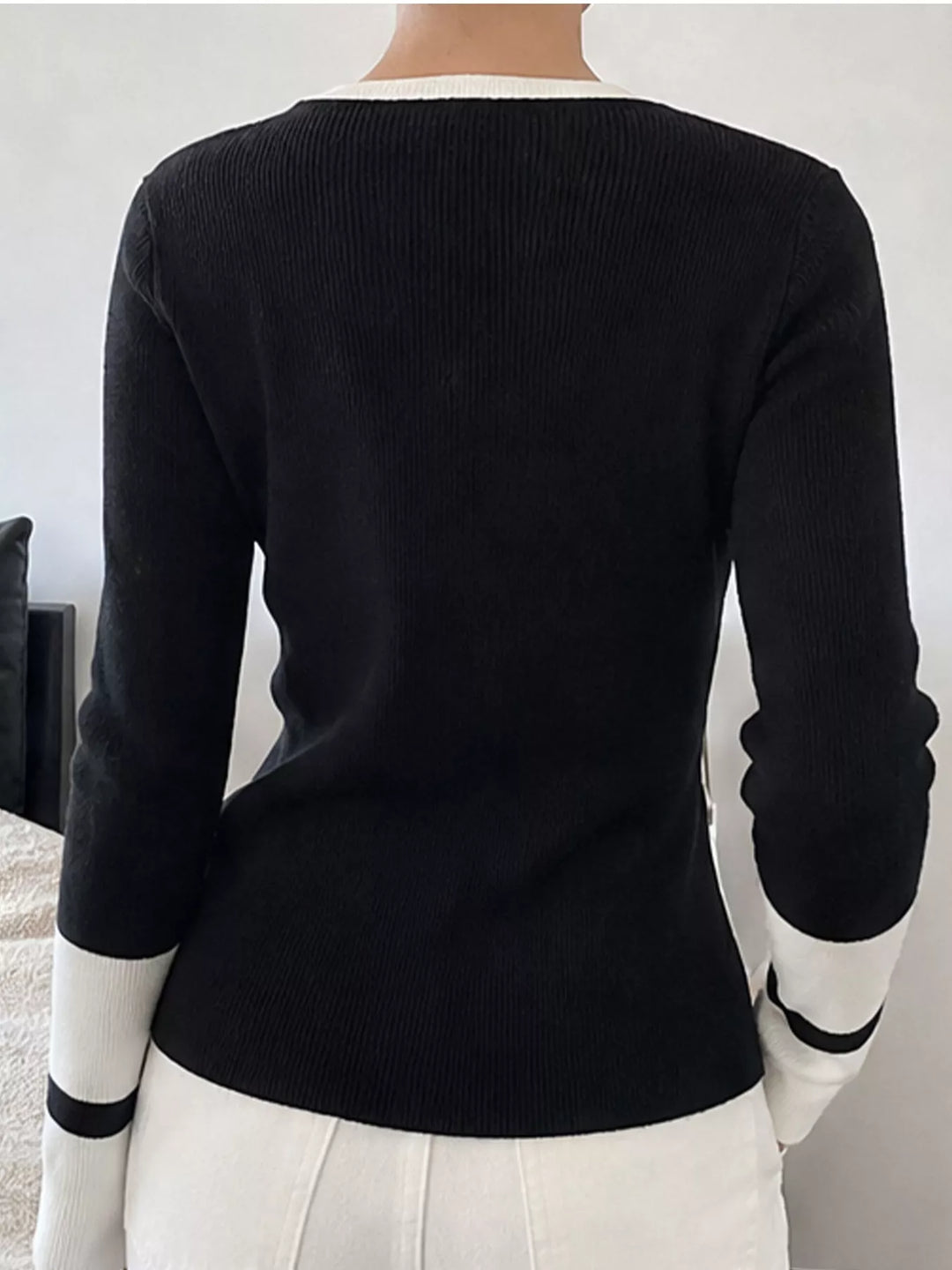 Ribbed knit side slit sweater with contrast trim