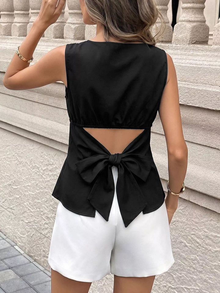 Sleeveless fitted top with cutout back and bow
