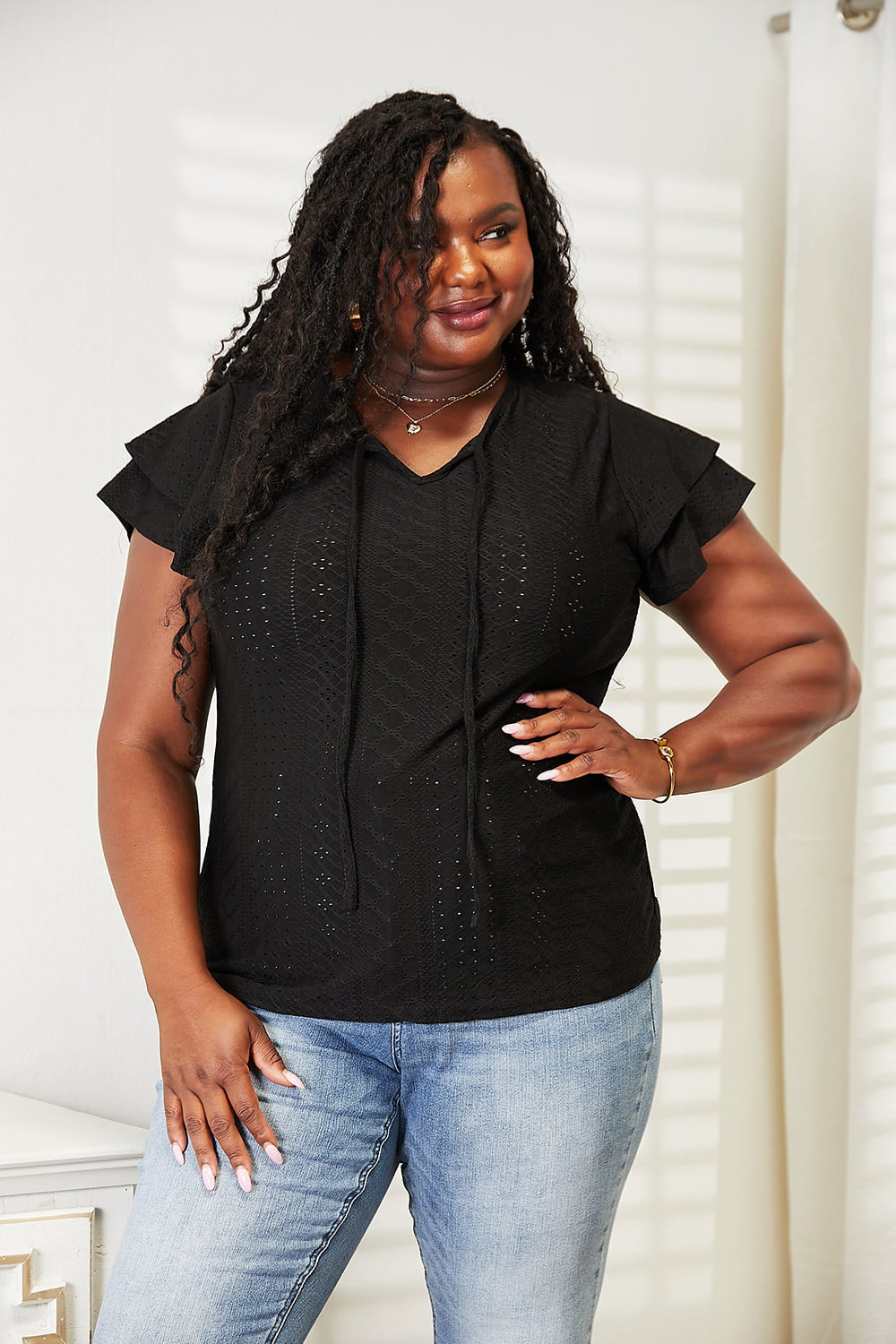 Eyelet tie-neck blouse with tiered flutter sleeves