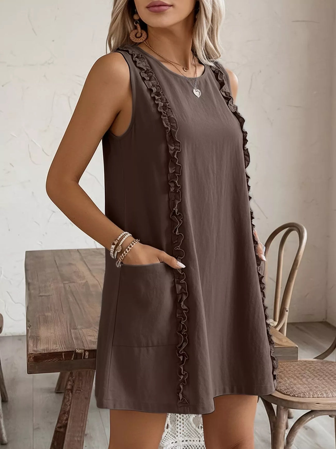 Ruffle-trim sleeveless mini dress with side pockets
